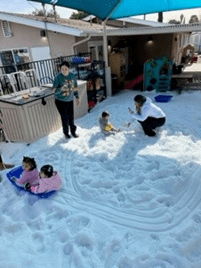 A group of people playing in the snow.