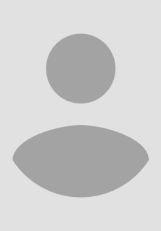 A person with two circles on their face and one of them is sitting.